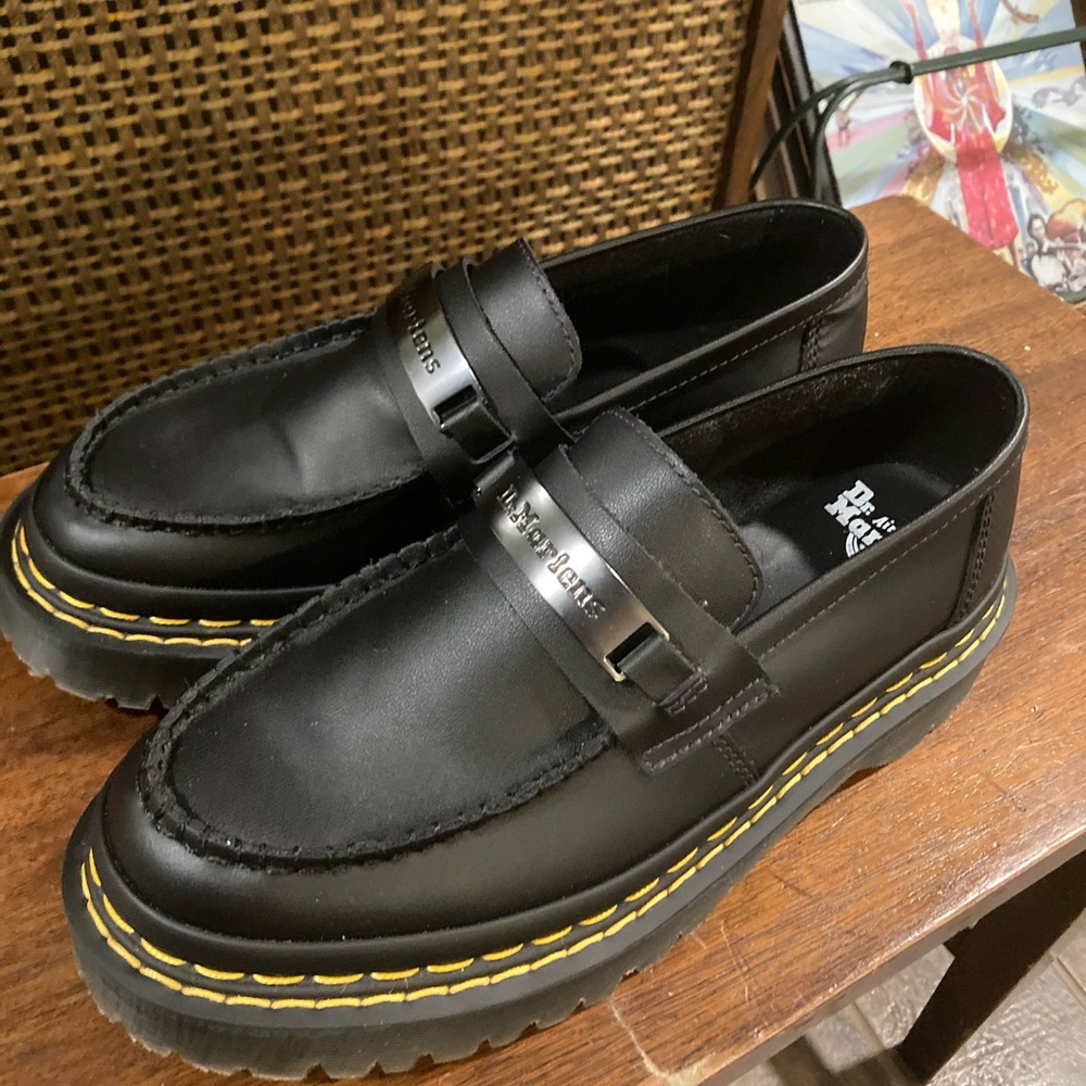 Dr. Martens Black Leather Lug-Sole Penny Loafers with Yellow Stitching